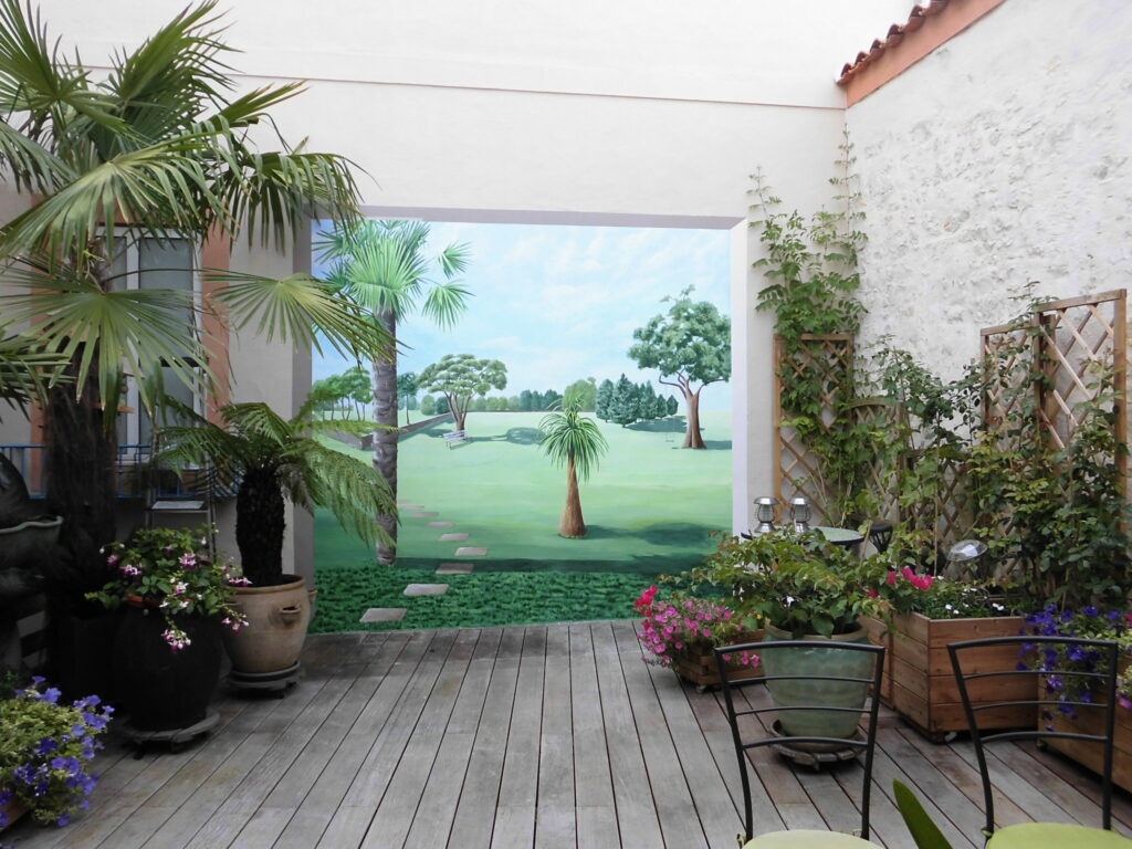 Trompe l'oeil sur mur extérieur terrasse - ouverture sur parc - Nathalie Coppolani Artiste peintre La Rochelle