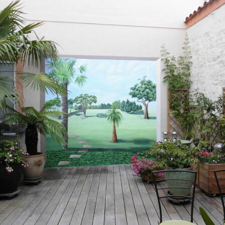 Trompe l'oeil sur mur extérieur terrasse - ouverture sur parc - Nathalie Coppolani Artiste peintre La Rochelle