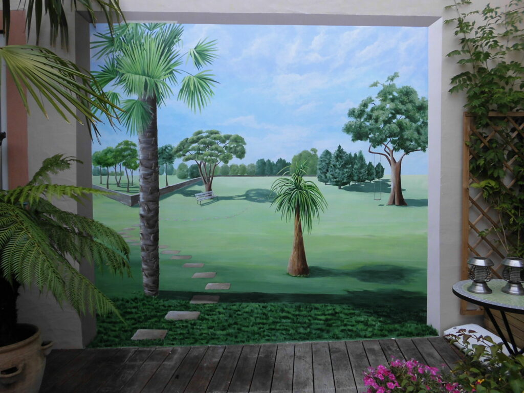 Trompe l'oeil sur mur extérieur terrasse - ouverture sur parc - Nathalie Coppolani Artiste peintre La Rochelle